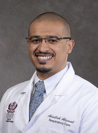 Dr. Alismail in white coat