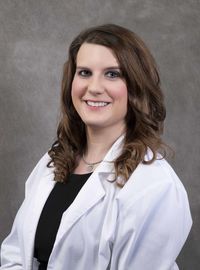 Dr. Berry in white coat