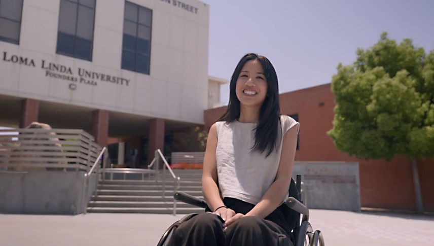 Faith sitting in wheelchair