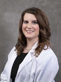Dr. Berry in white coat